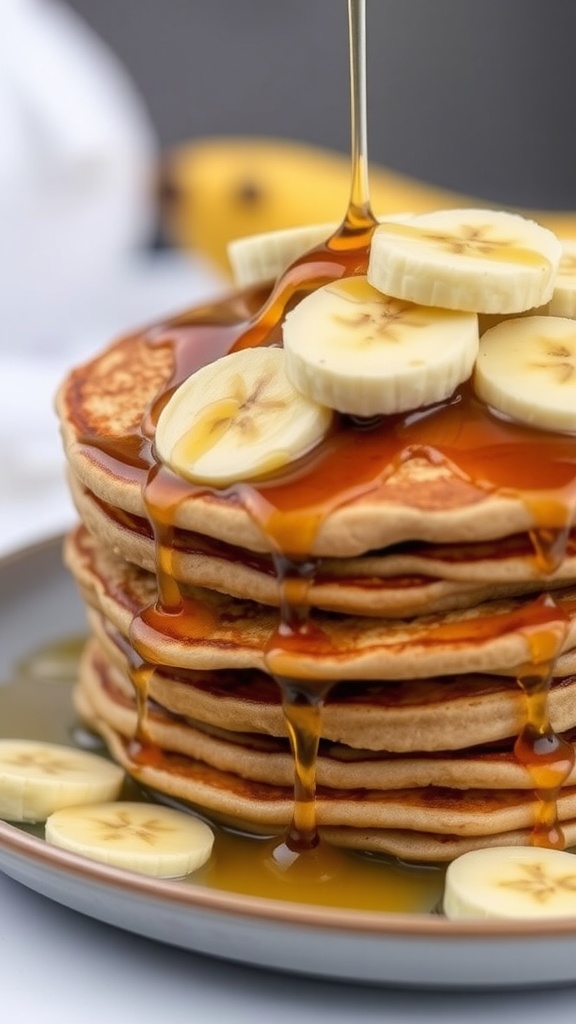 A stack of whole wheat banana pancakes with sliced bananas and syrup drizzled on top.